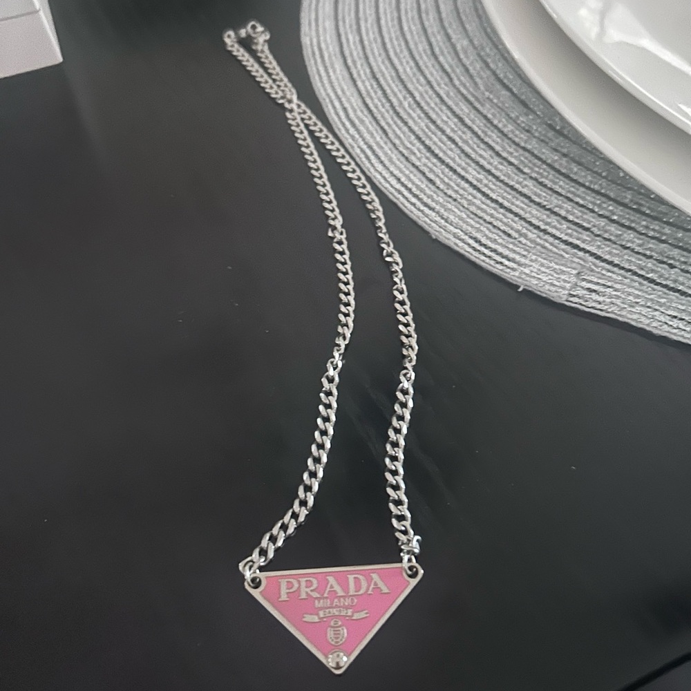 Prada triangle tag